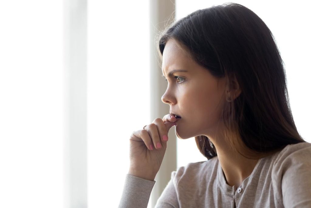 woman looking off wondering about signs of opioid abuse