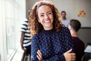 a person smiles at the camera possibly enjoying the Benefits of residential substance abuse treatment