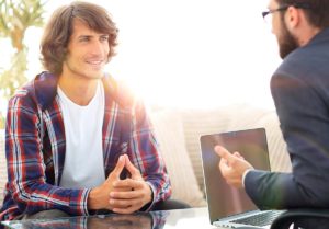 two people talk possibly answering What is residential treatment