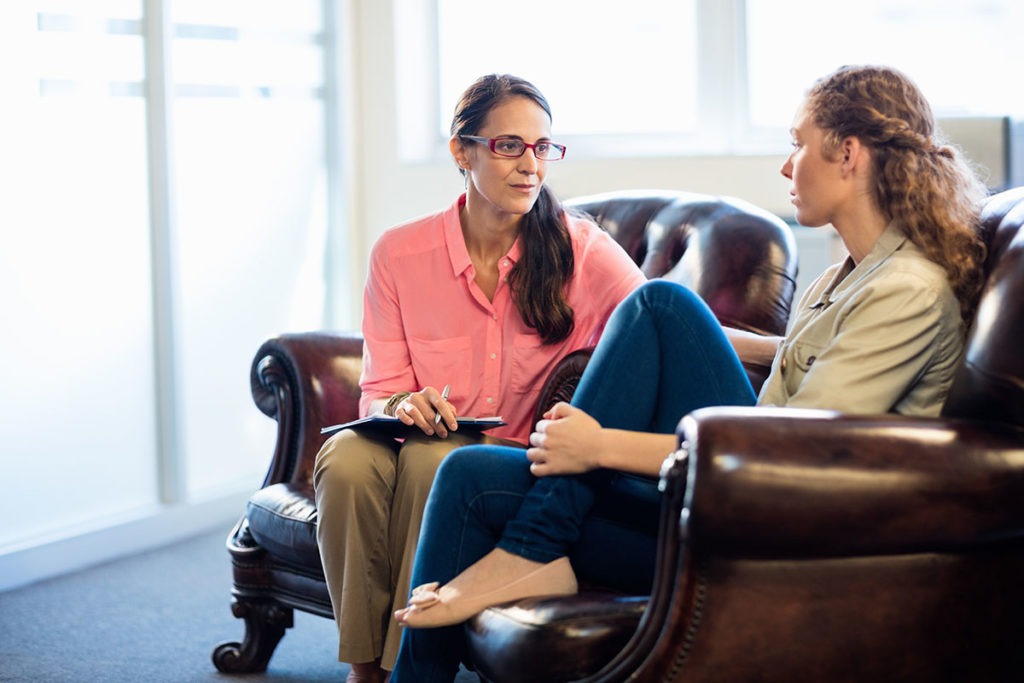 two people talk potentially discussing What is a early intervention program