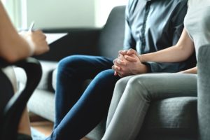 a couple talks to a therapist during a Dual diagnosis programs in san diego