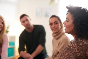 people in a group discuss Triggers for relapse