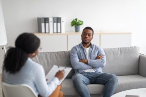 a person in a Medication assisted treatment program talks to a therapist