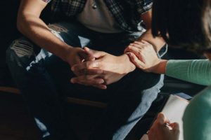 family members gather to help a person with an Early intervention for substance abuse